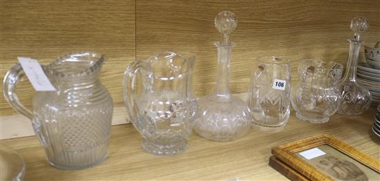 A pair of Victorian bottle decanters and four water jugs